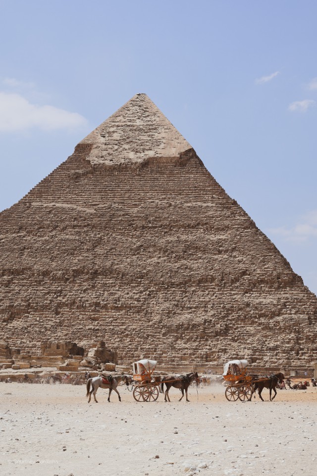 Pyramid of Khafre with horse-drawn carriages at the base, Giza, Egypt