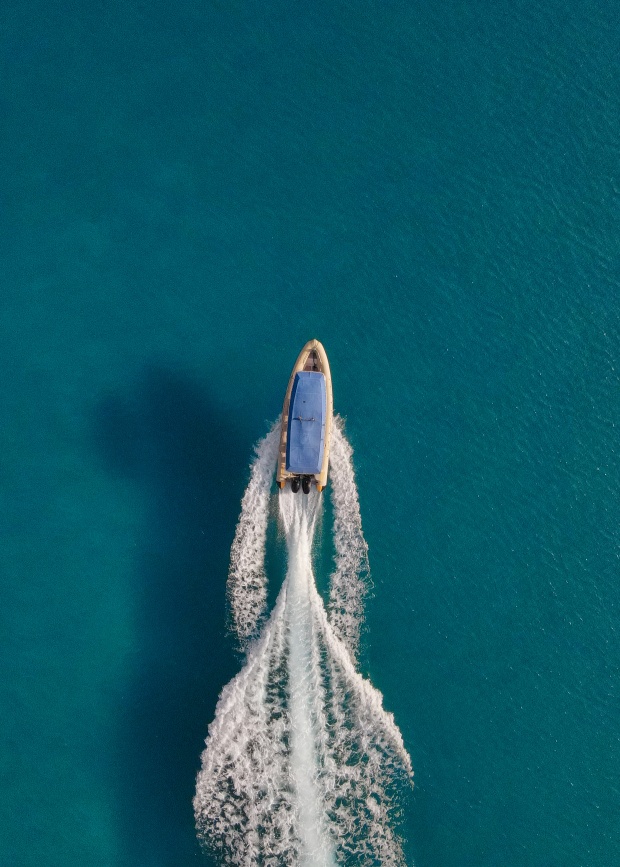 Aerial view of Fanifo Lofa boat on turquoise water in Ha'apai Tonga