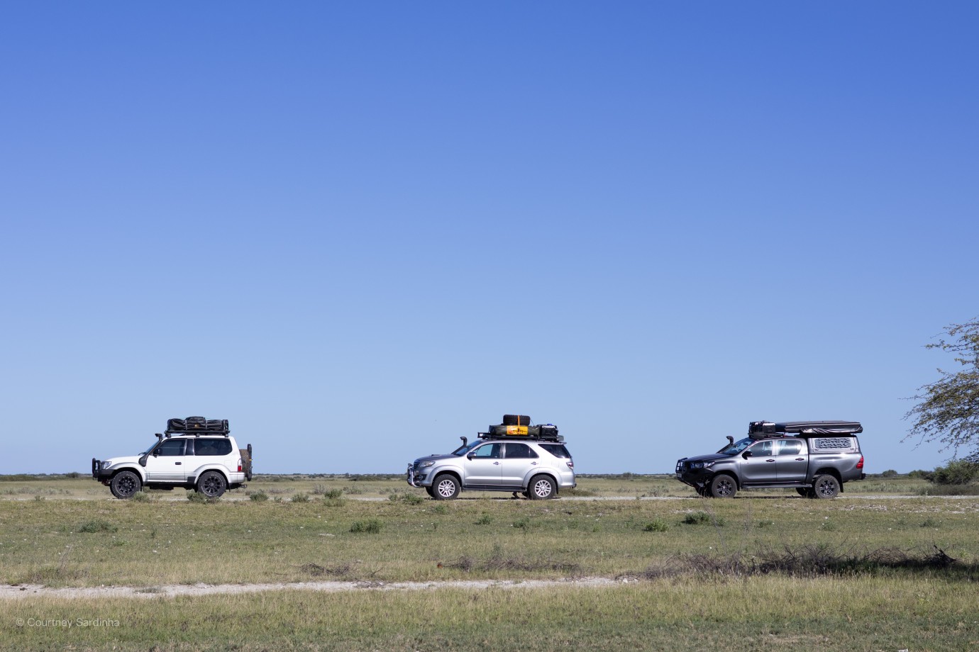 Three overland safari vehicles, Botswana
