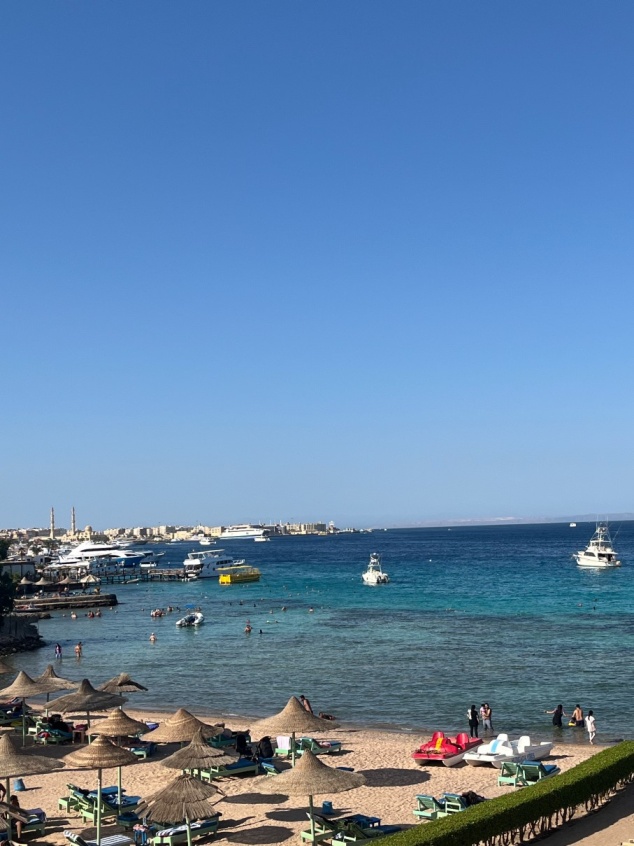 Hurghada coastline with boats and beach umbrellas on the Red Sea, Egypt