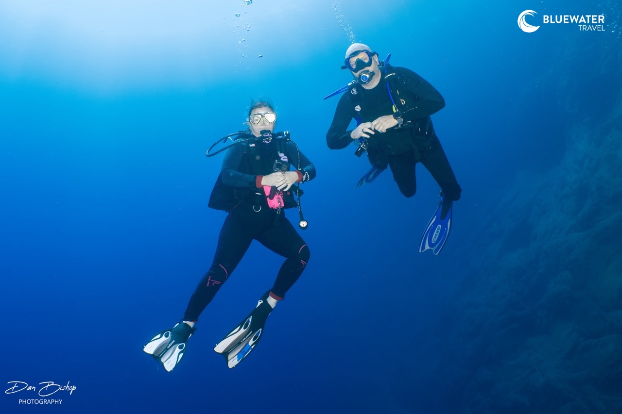 Two divers show off their buoyancy
