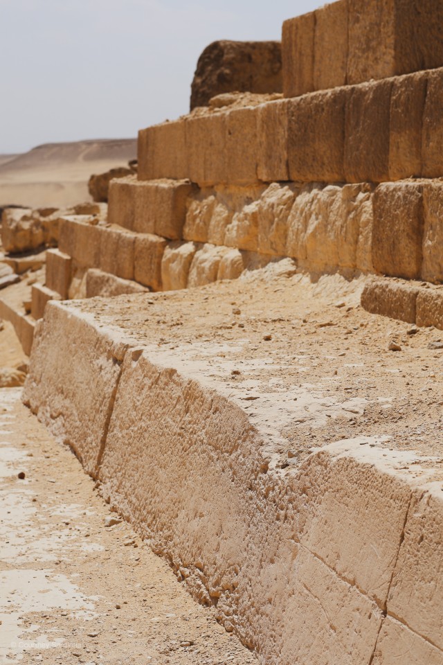 Ancient stone blocks at the base of the Pyramids of Giza, Egypt