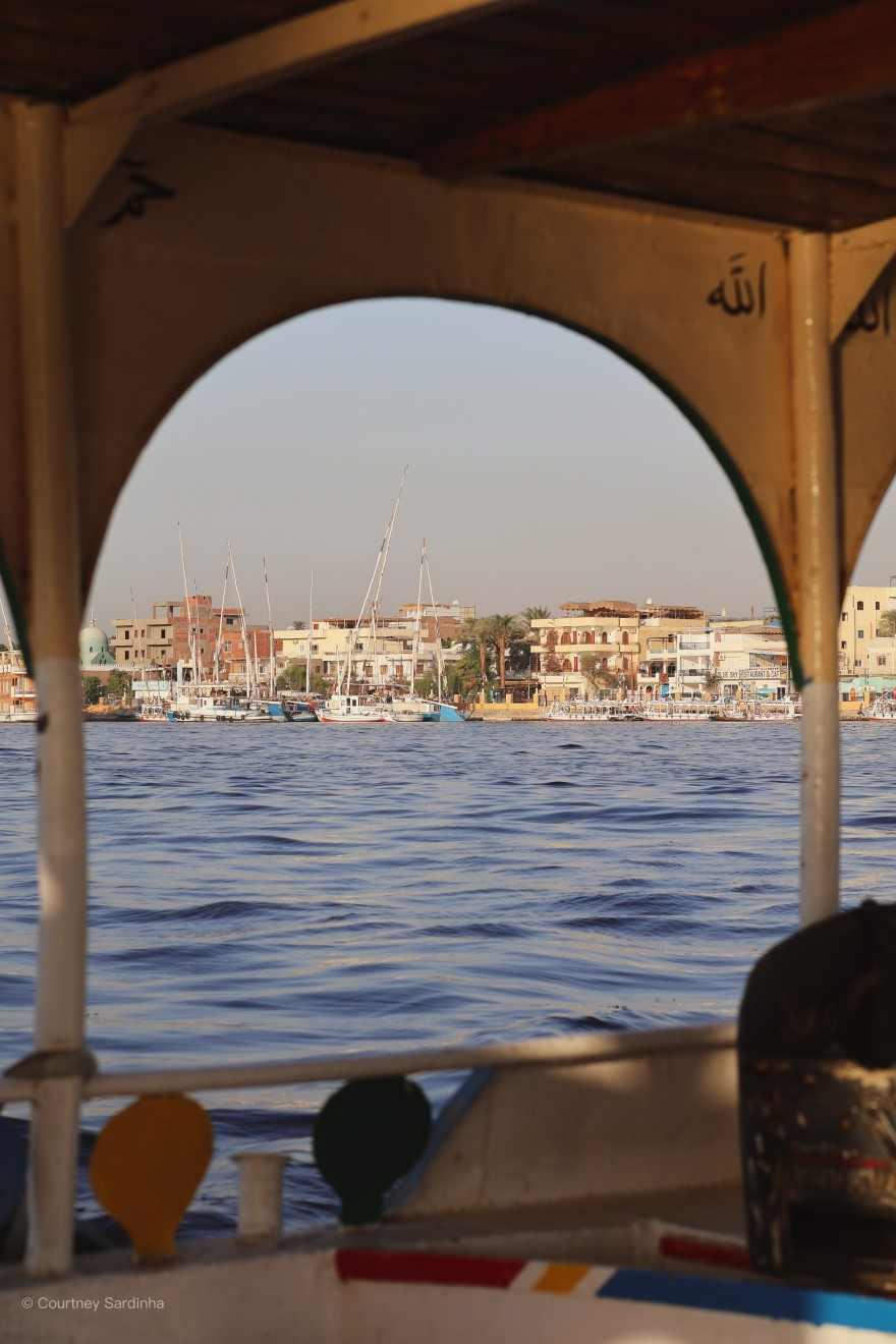 View of the Nile River through an archway in Luxor, Egypt