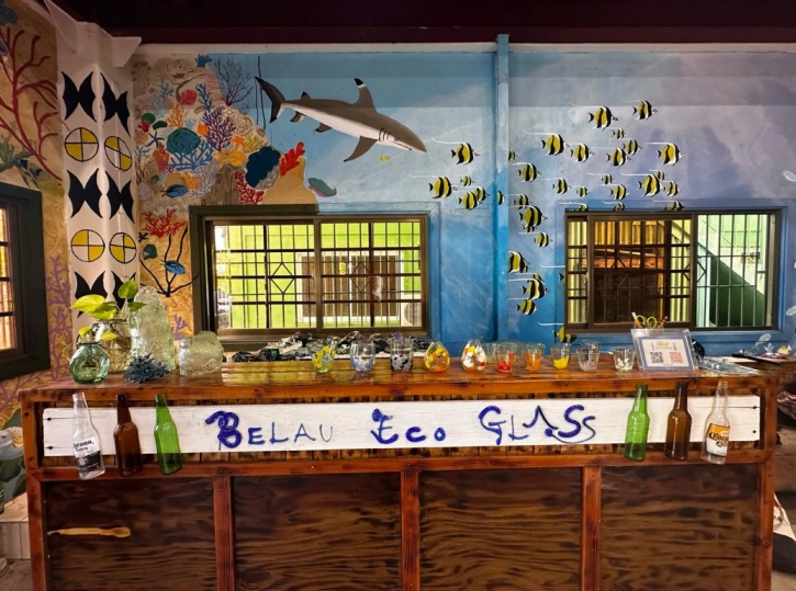 Glassmaking shop counter with handmade glass pieces.