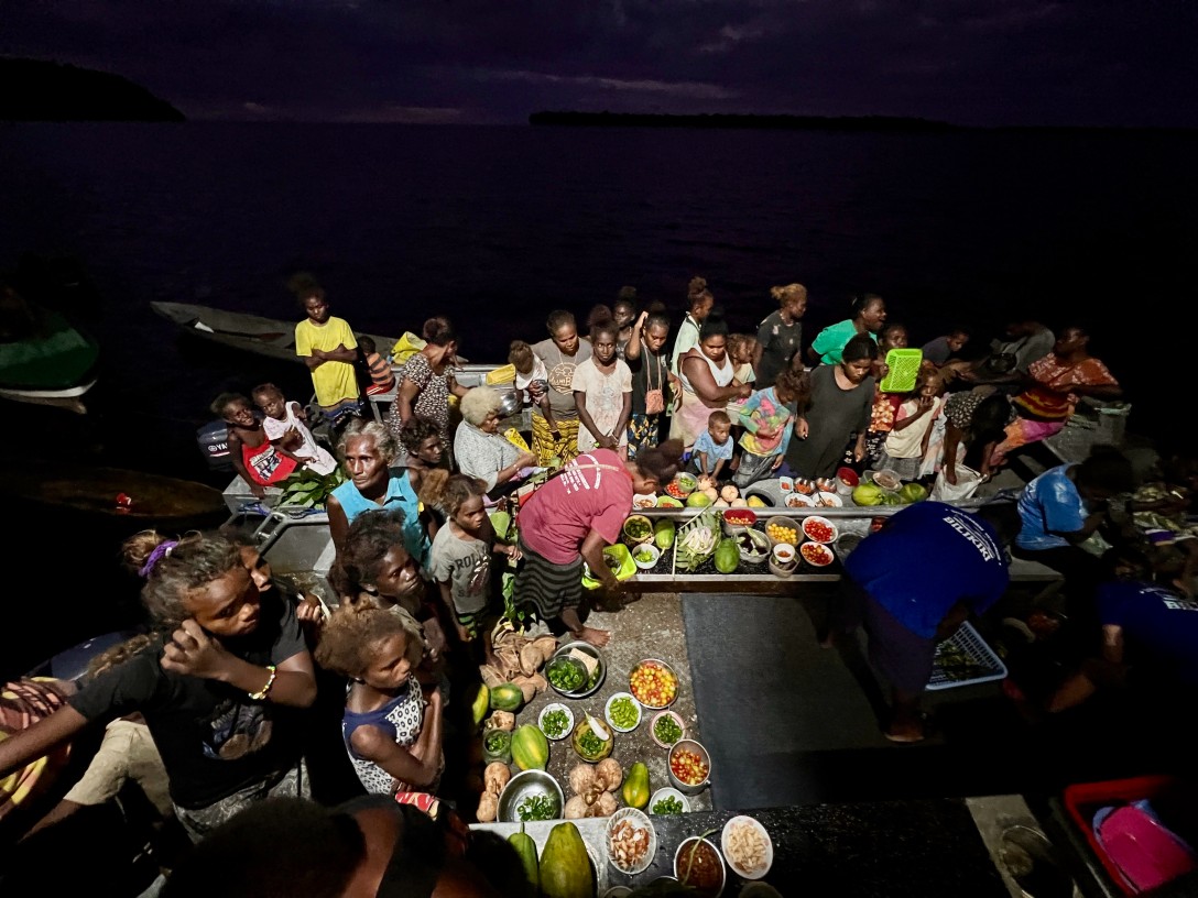 Local families gathered with fresh produce at the floating market